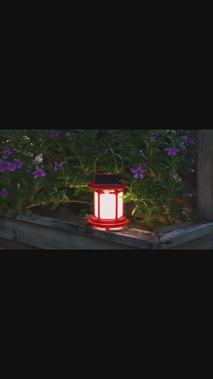 Load video: New outdoor garden solar portable hanging lamp, waterproof small palace lantern, home garden camping atmosphere lamp